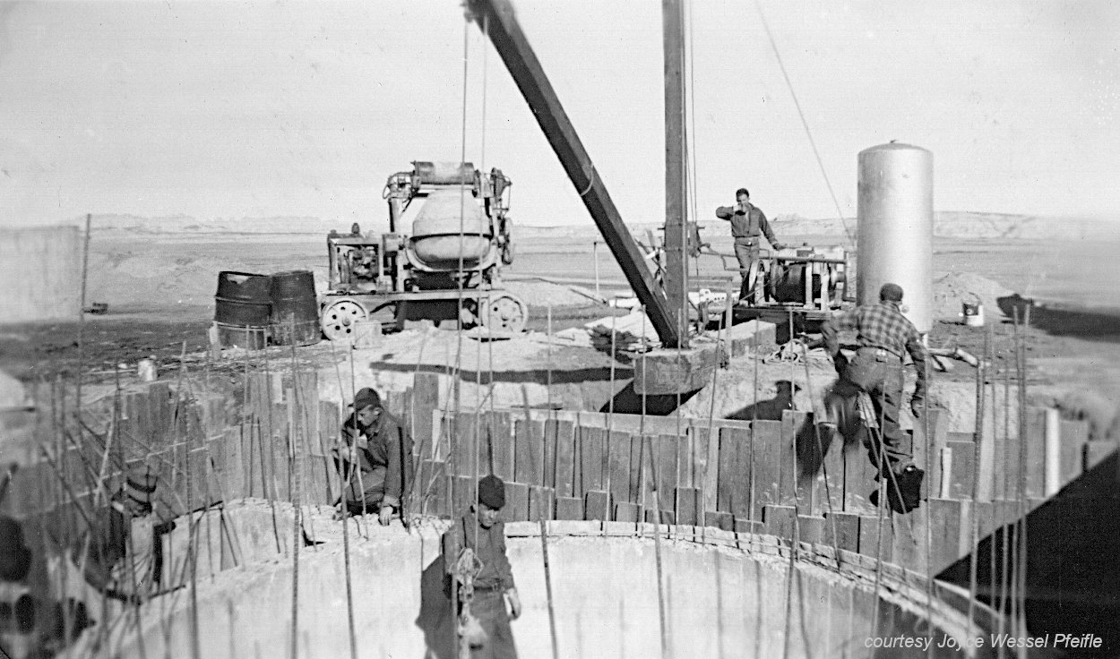 men and equipment at work site