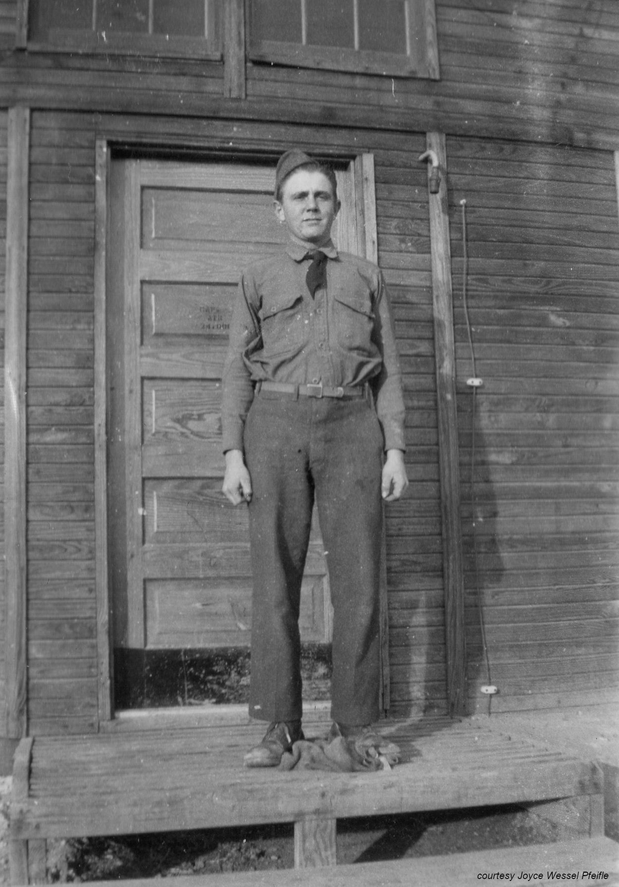 man in front of building