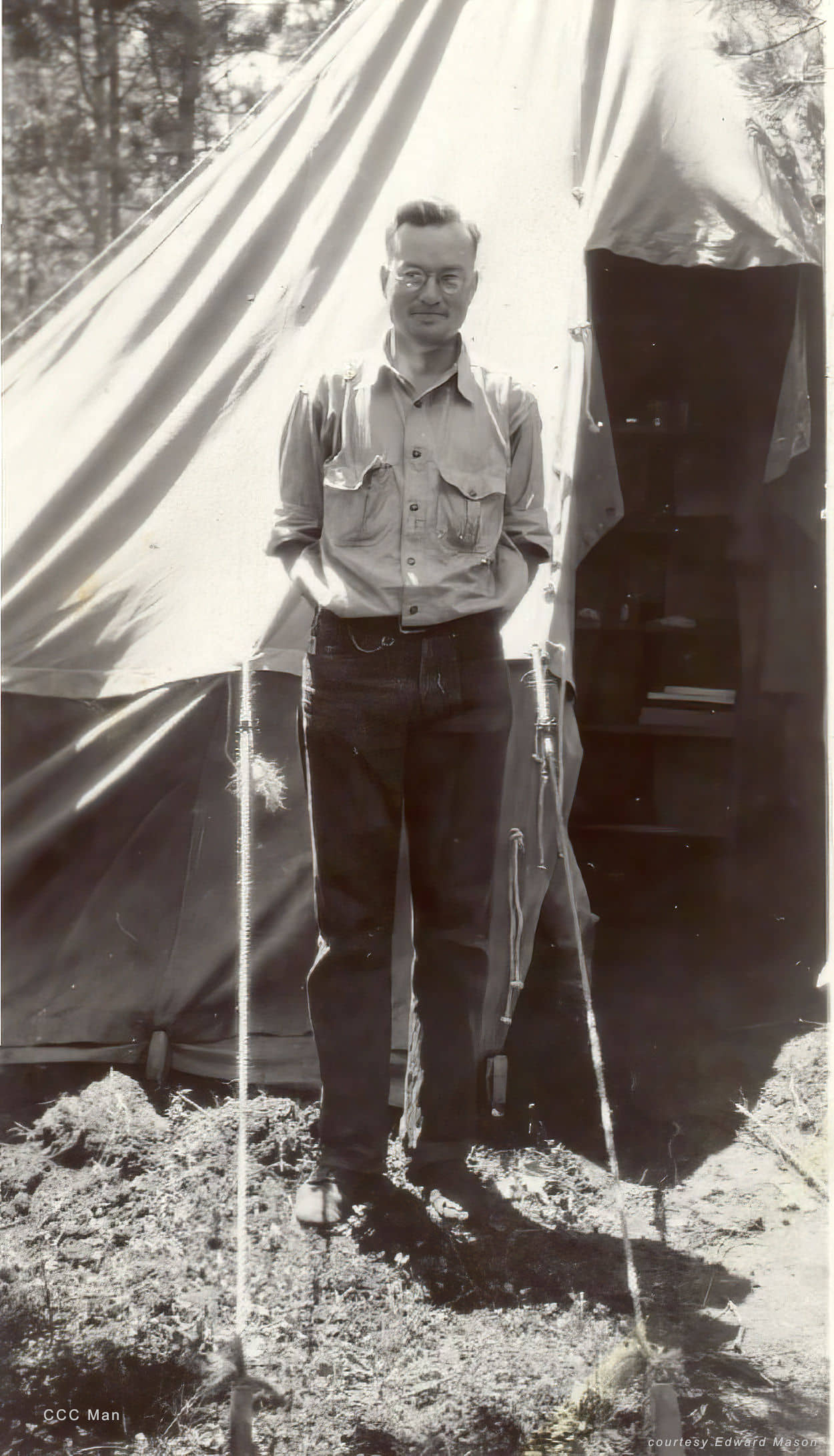 man in front of tent