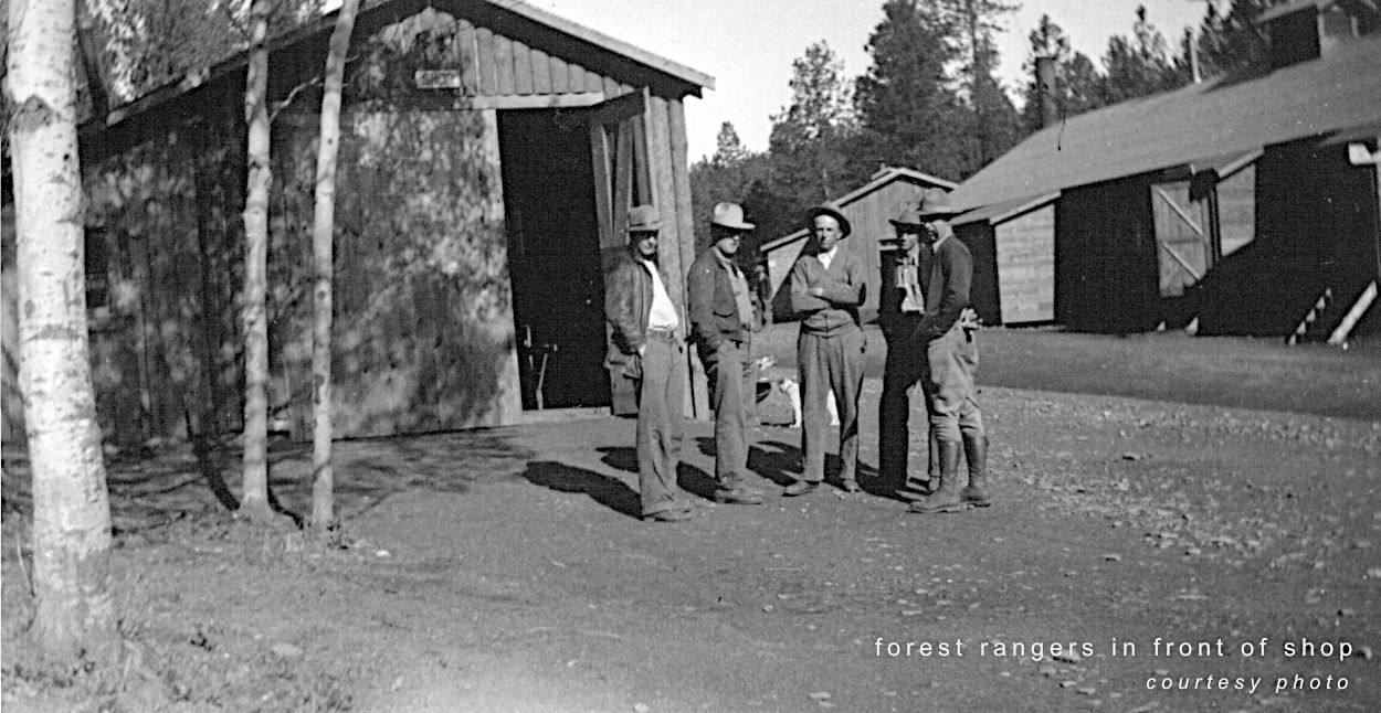 forest rangers in fron of shop